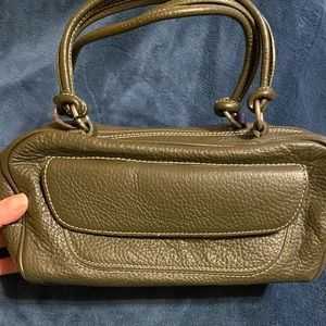 GUIA’s gray Italian leather handbag.